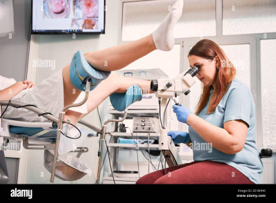 gynecologist-using-colposcope-while-examining-woman-in-gynecological-clinic-female-patient-laying-in-gynecological-chair-concept-of-gynecology-medical-examination-and-female-health-2E18HH0.jpg
