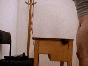 The Cane For Heather - schoolgirl caned over DESK-1.gif