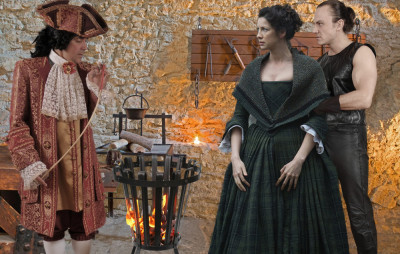 Claire is shown the tools of torture.jpg